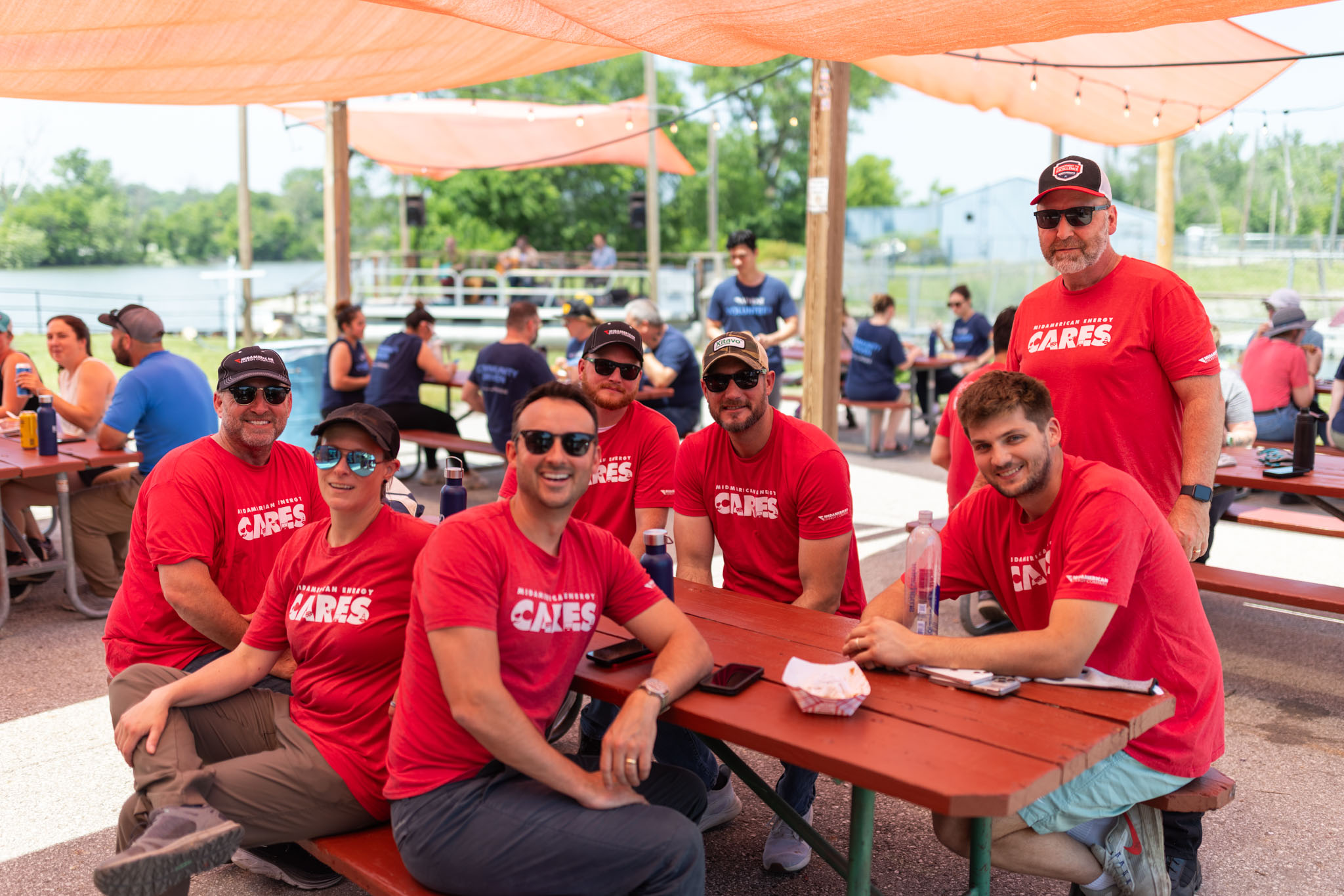 A group of volunteers in red CARES shirts