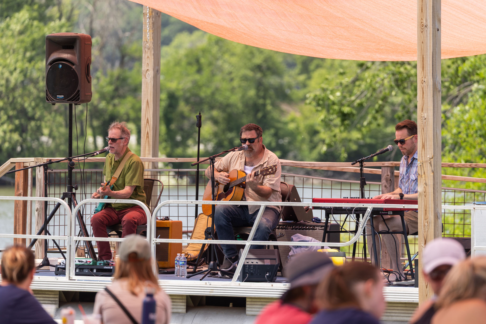 A band playing for the Riverfest volunteers