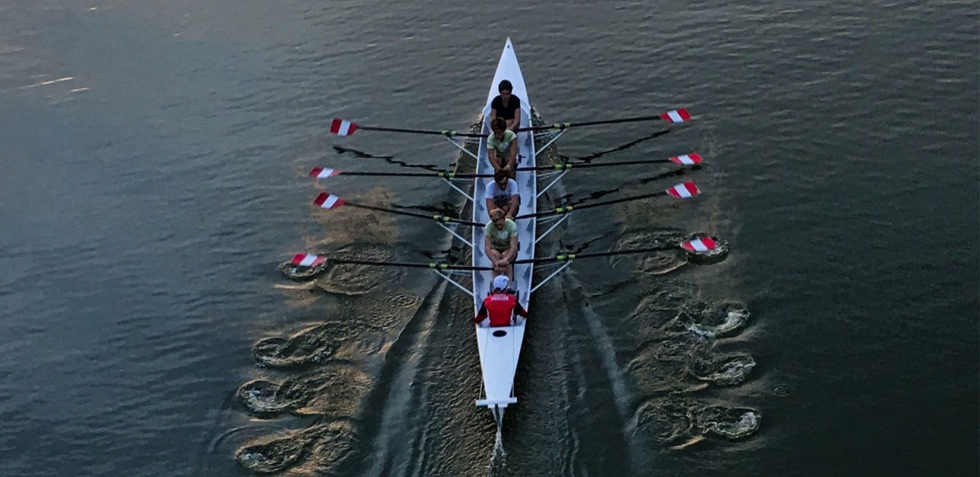 A team of rowers on a river