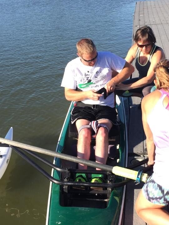 Getting situated in his boat next to the dock
