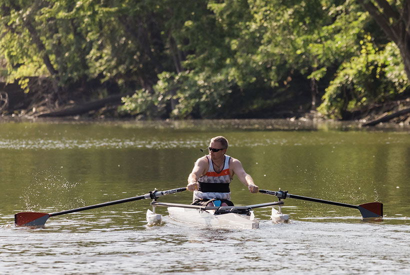 A man rowing on the Des Moines River