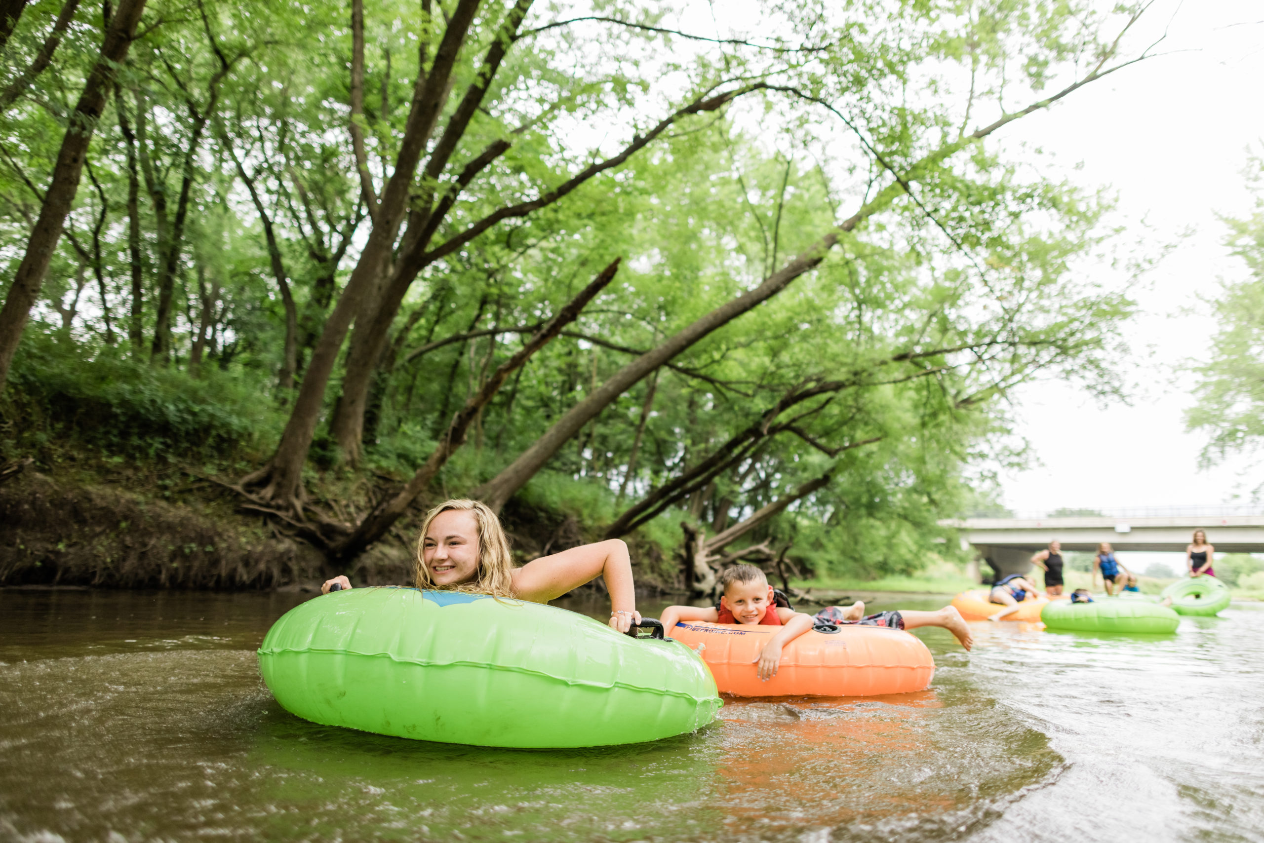 Kids riding tubes down the river