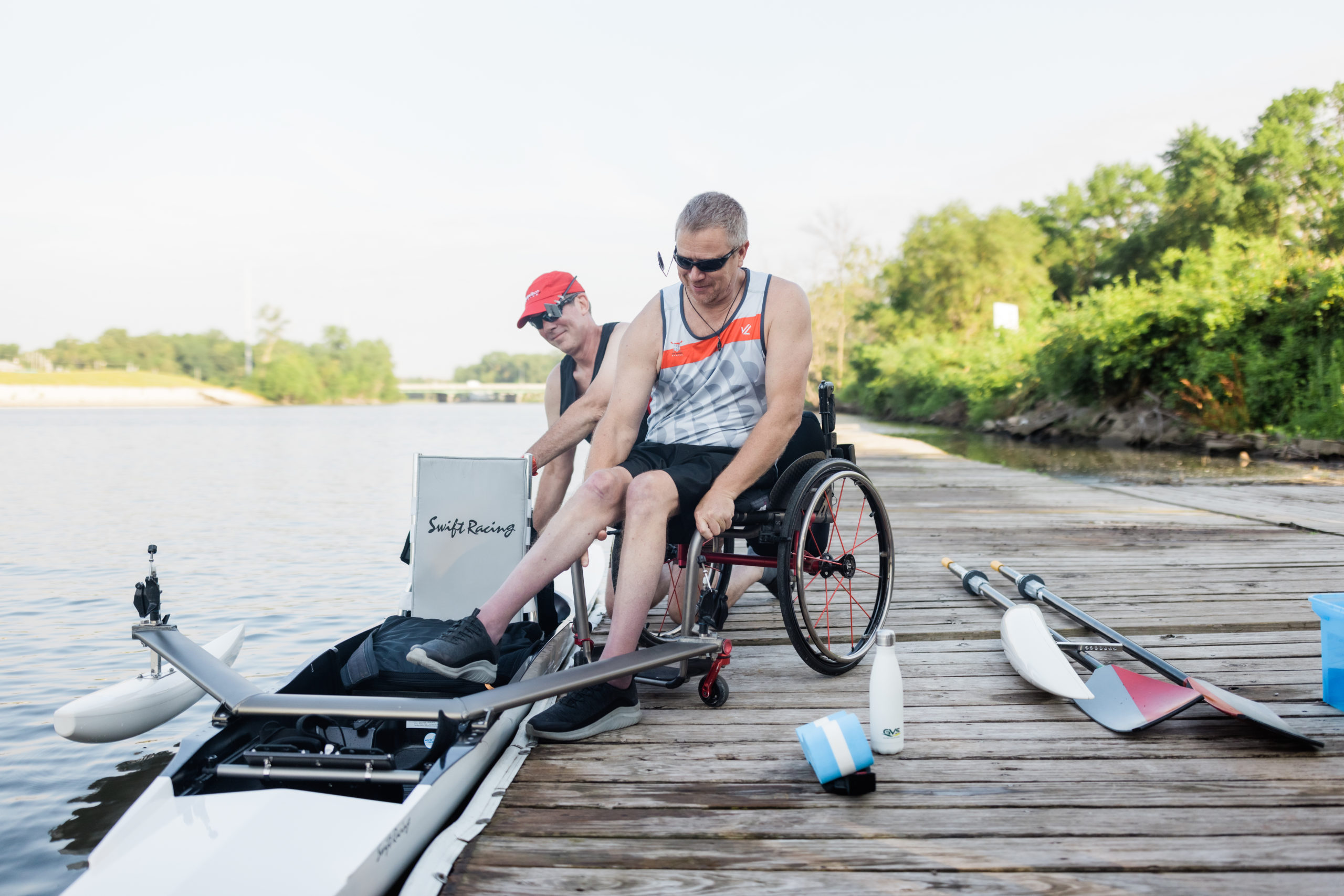 ICON-water-trails-0001-scaled Para-rower getting in to his boat from the dock